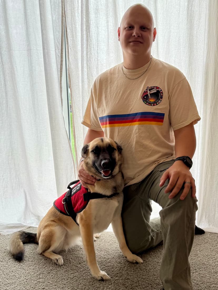 Anthony Rodriguez, solo digital operations consultant, with his service dog